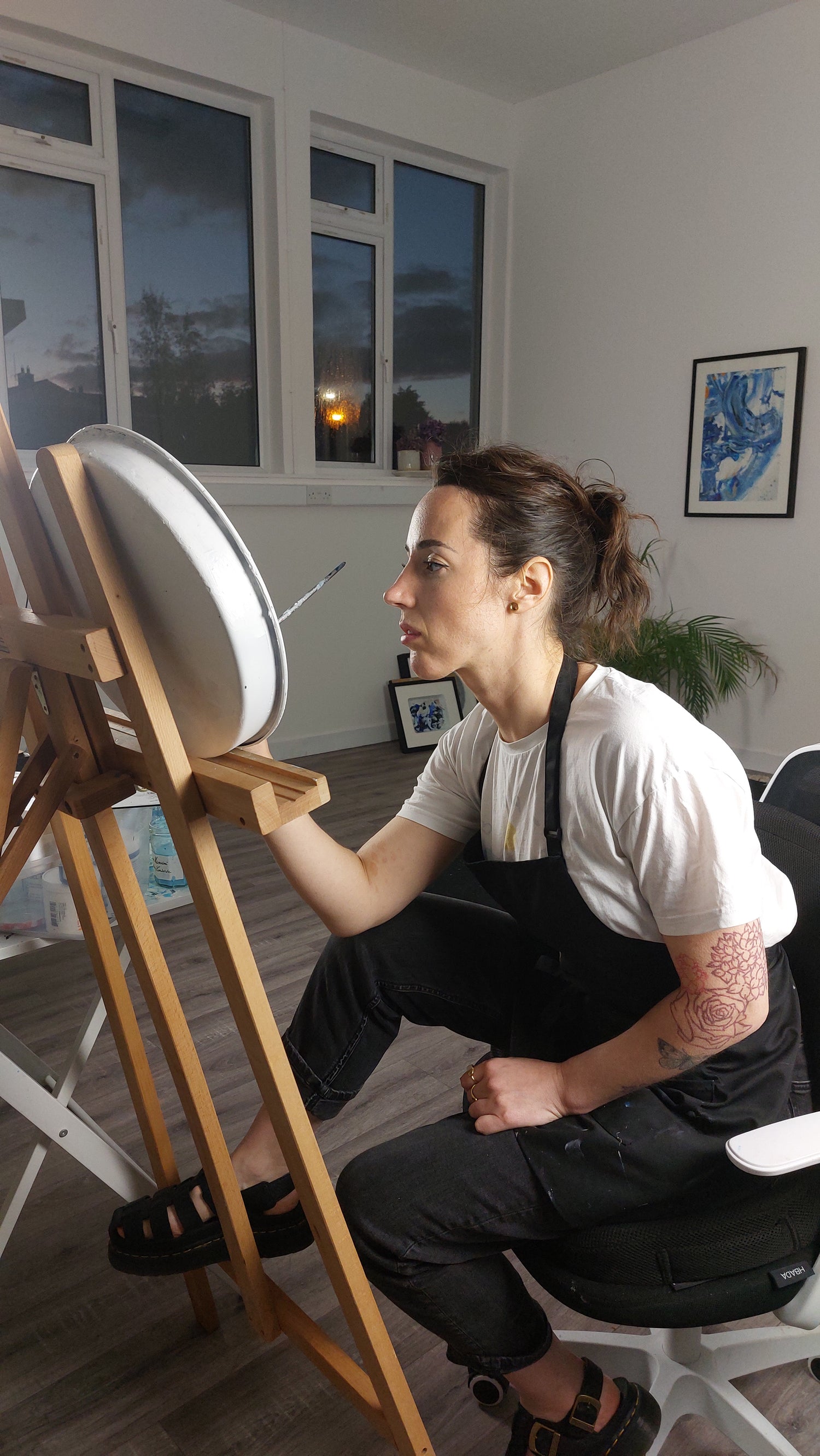 Irish artist Bridie Keogh painting in her studio long into the night